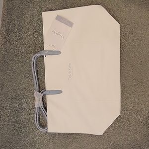 Soft white leather Calvin Klein tote with blue gray straps and edges NWT
